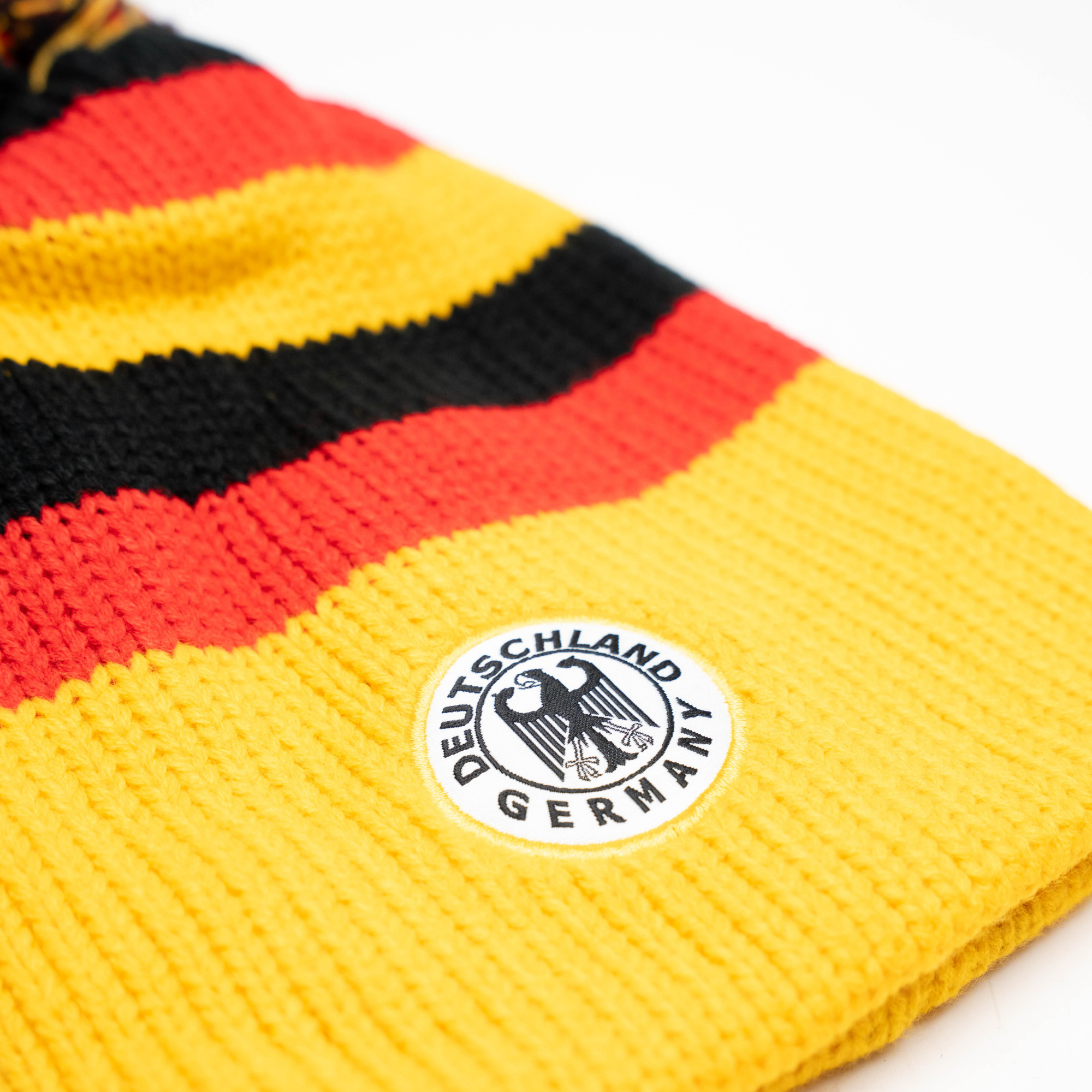 Hat black red yellow knit